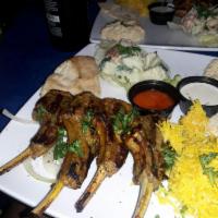 Lamb Chops · 1/2 a rack of lamb chops marinated in special seasoning. Served with saffron basmati rice an...