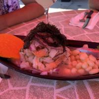 Ceviche Mixto · Fish, shrimp, calamari and mussels cooked in special lime juice served with sweet potato and...