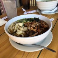Chicken Teriyaki Udon Soup · Thick, wheat-flour noodle served with teriyaki chicken, tofu, green onion, and wakame (seawe...