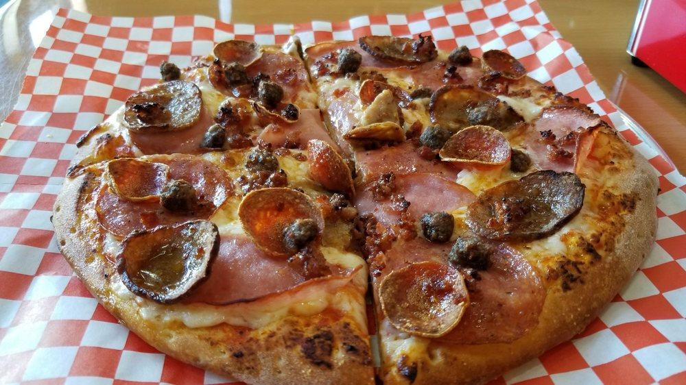 Meat Lovers' Pizza · Vine-ripened tomato sauce, Canadian bacon, salami, pepperoni, spicy Italian sausage, bacon and beef.