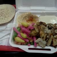 Chicken Tarna Plate · Marinated and broiled chicken, hummus, tahini, lettuce, tomatoes, pickled turnips, garlic sa...
