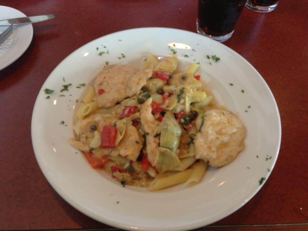Pollo Artichoke · Fresh chicken breast sauteed in white wine, lemon, capers and artichoke roasted red peppers over farfalle.