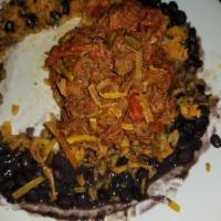 Ropa Vieja · Shredded skirt steak with onions, bell peppers and plum tomatoes.