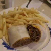 Philly Cheese Steak · Served with french fries.