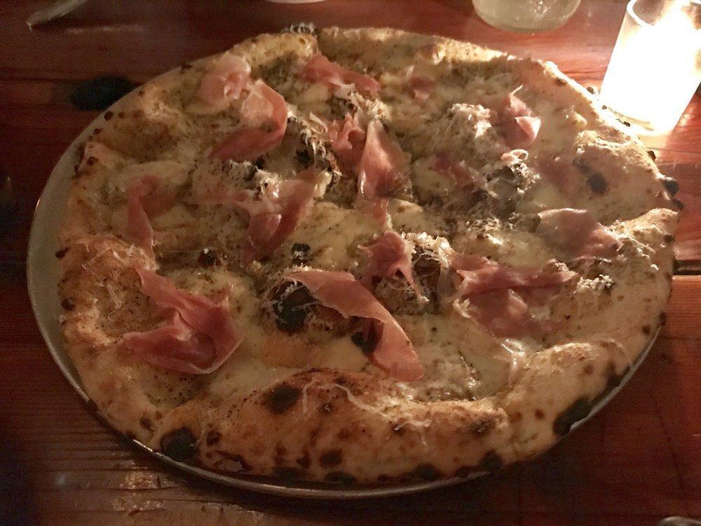 Cheesus Christ Pizza · Mozzarella, taleggio, Parmigiana, black pepper and cream.