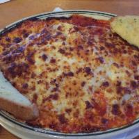 4 Cheese Baked Spaghetti · Baked spaghetti noodles in Romio's special marinara sauce, smothered with mozzarella, Parmes...