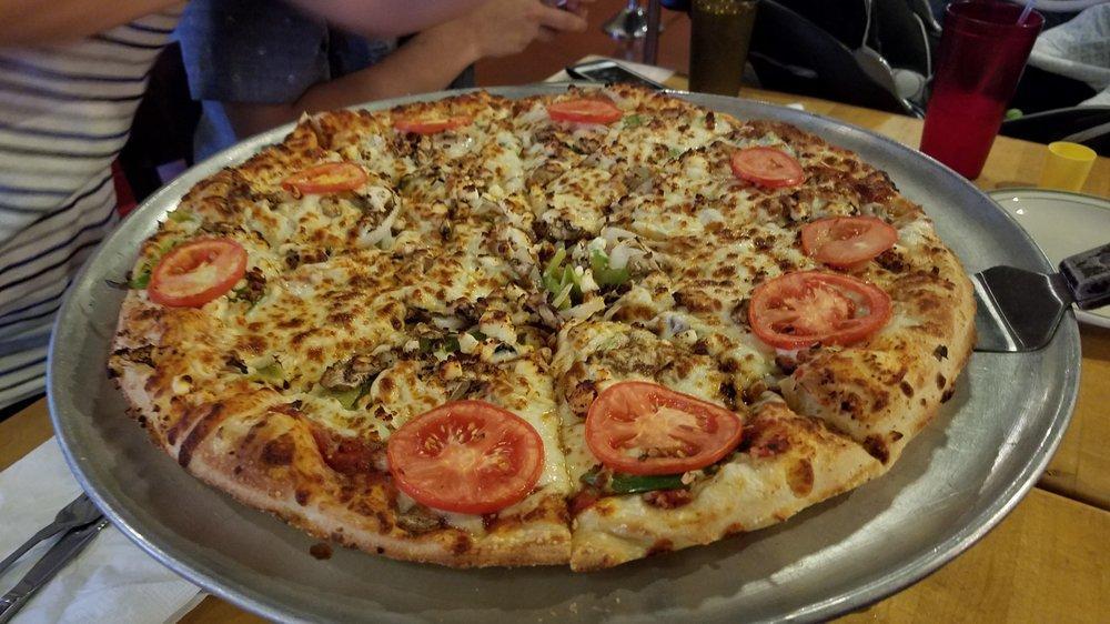 House Special Pizza · Pepperoni, Canadian bacon, mushrooms, onions, green peppers, tomatoes and feta cheese. With homemade pizza sauce, smothered in mozzarella on our fresh Romio's homemade dough.