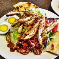Chicken Cobb Salad · Served with grilled chicken breast, bacon, lettuce, tomatoes, hard boiled egg and cheddar ch...