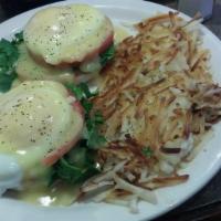 Eggs Florentine Special · 2 poached eggs with tomatoes and fresh spinach on an English muffin, topped with hollandaise...