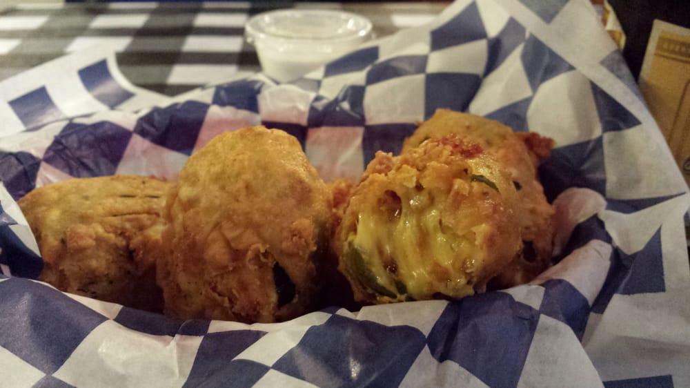 Jalapeno Bombers · 5 battered jalapenos stuffed with bacon, Cheddar, and Monterey Jack cheese.