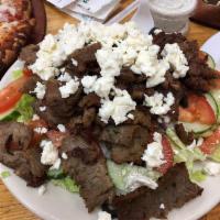 Greek Salad · Lettuce, fresh tomatoes, red onions, cucumbers, black olives, feta cheese, mixture of extra ...