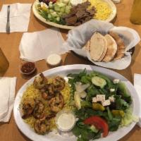 Gyros Plate · Delicious seasoned blend of beef and lamb, thinly sliced with tzatziki sauce. Served with ri...