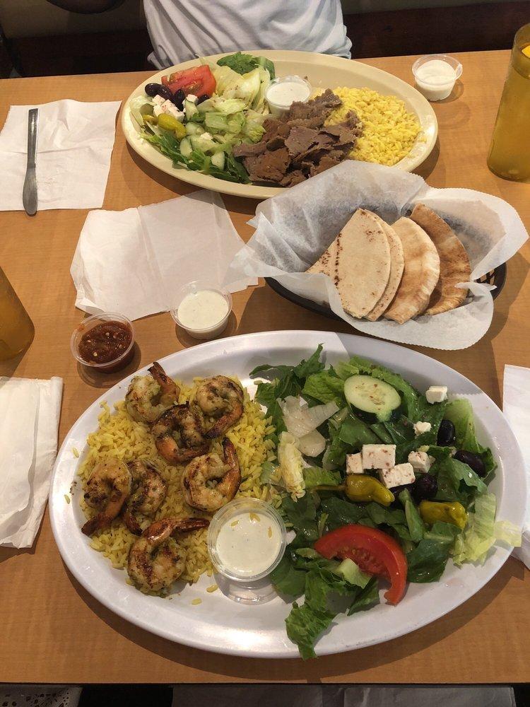 Gyros Plate · Delicious seasoned blend of beef and lamb, thinly sliced with tzatziki sauce. Served with rice, salad and pita bread.