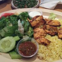 Chicken Kabob Plate · Marinated Greek-style chicken breast charbroiled to perfection. Served with rice, salad, pit...