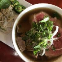 Pho Street Special - Pho Dac Biet · Steak, beef brisket, meatball, tendon and tripe in hearty beef broth and rice noodle. served...