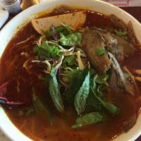 Spicy Beef Broth Noodle - Bun Bo Hue · Authentic flavorful Viet dish served with sliced beef shank, brisket, pork hocks and pork ro...