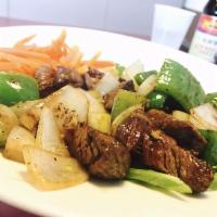 Shaken Beef Com Bo Luc Lac · Cubed beef tenderloin sauteed in onions, garlic and bell pepper, with tomato and lettuce.