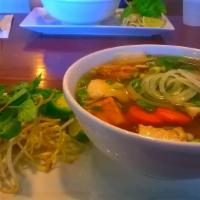 Vegan Pho - Pho Chay · Fried tofu, carrot, broccoli, enoki mushroom, seasonal veggies in vegan broth and rice noodl...