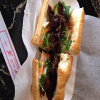 Grilled Lemongrass Beef · All Vietnamese sandwiches served with cucumber, cilantro, jalapenos, Hossain sauce, green on...