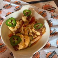 Not Your Mama's Deviled Eggs · Five lightly fried deviled eggs with a spicy filling, crumbled bacon & garnished with a fres...