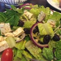 Greek Salad · Romaine lettuce, cucumbers, tomatoes, red onions, and olives feta. Gluten-free. Vegetarian.