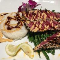Seared Sesame Seed Tuna Steak Dinner · Served with haricot verts, sushi rice, Sriracha, and soy sauce reduction.