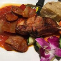 French Pork Chop Giambotta Dinner · Green and red bell peppers, Italian sausage, scalloped potatoes, and brown sauce.