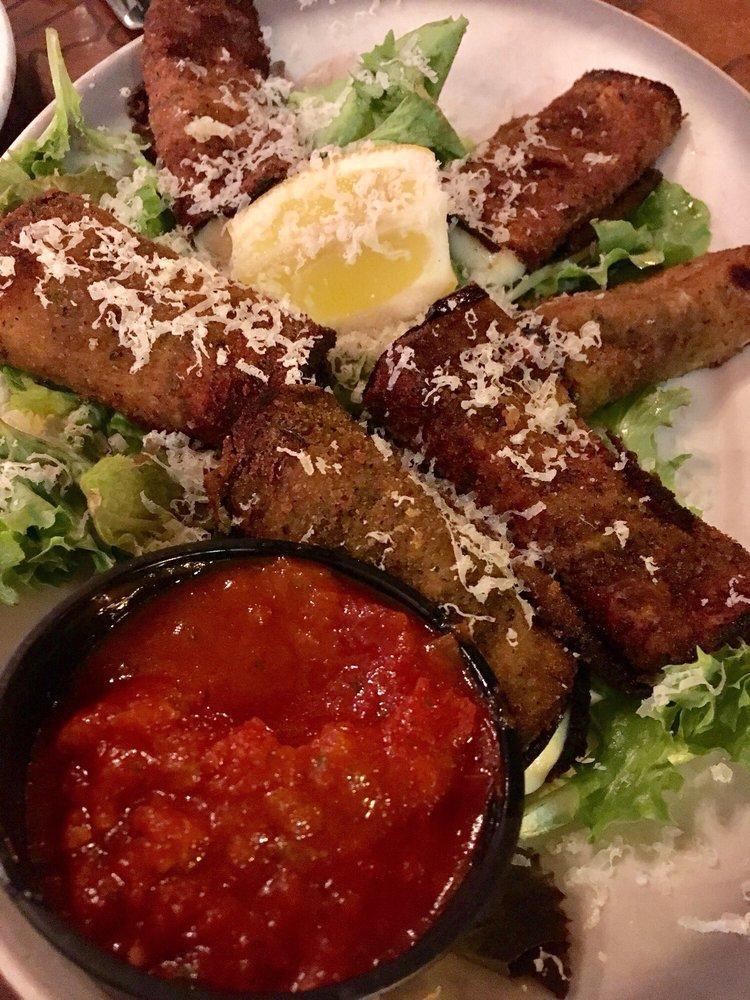 Eggplant Rotoli · Thinly sliced eggplant breaded and wrapped around fresh Mozzarella cheese and fresh basil, baked and drizzled with fresh lemon. Served with a side of marinara.