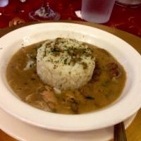Smoked Chicken & Sausage Gumbo · Traditional brown gumbo made with a real roux and served with white rice.