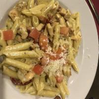 Pasta Siena · Shrimp and chicken sauteed with pesto, garlic, and red chili flakes, tossed with sun-dried t...