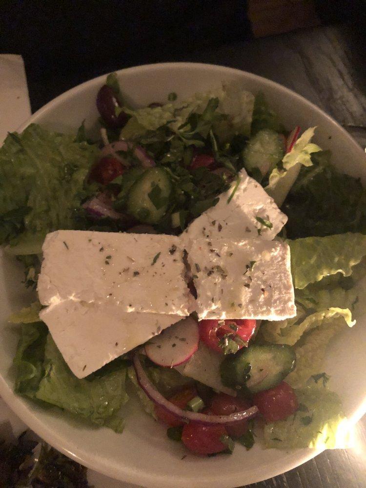 Greek Salad · Feta cheese, romaine, cucumber, tomato, red onion, fresh herbs, za'atar croutons, extra virgin olive oil and squeeze of lemon.