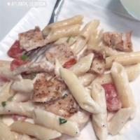 Penne Chicken Alfredo · Blackened chicken breast, penne, cream sauce, scallion and fresh tomato. Substitute shrimp f...