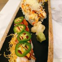 Firecracker Roll · Shrimp tempura, cucumber, crab inside, spicy tuna on top with fried sweet potato & jalapeno.