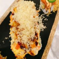 Dynamite Roll · Baked scallop and crab mix on top of Calfornia roll.