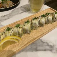 Snow White Roll · Spicy shrimp, cream cheese, avocado inside, torched white tuna on top with green onion wasab...