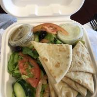 Greek Salad · Vegetarian. Our traditional Greek salad -- Kalamata olives, Feta cheese, sliced tomatoes, on...