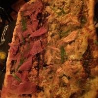 Roasted Pulled Chicken Pizza · Basil oil, oven roasted chicken, sweet onions and aged provolone.