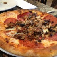 New York Style Pizza · Mushrooms, all-natural pepperoni, salami, Italian sausage and house-made tomato sauce.