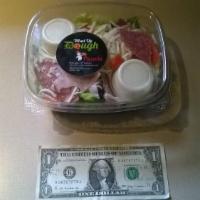Antipasto Salad · A large salad with lettuce, tomato, black olive, banana pepper, ham, and salami topped with ...