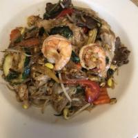 Drunken Noodle · Stir-fried rice noodles with a combination of meat; beef, chicken, pork and shrimp with egg ...