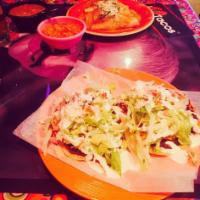 Tostadas · Stuffed crispy rolled tortillas topped with lettuce, sour cream, cheese & pico de gallo (2 p...