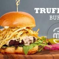 Truffle Burger · 6 oz. Angus patty, brioche bun, white cheddar, baby arugula, truffle aioli and crispy shoest...