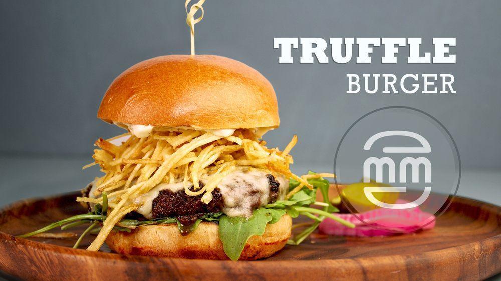 Truffle Burger · 6 oz. Angus patty, brioche bun, white cheddar, baby arugula, truffle aioli and crispy shoestring fries.