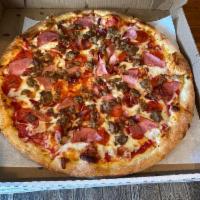 Meat Lovers Pizza · Tomato sauce, mozzarella, pepperoni, Canadian bacon, real bacon, meatballs and sausage.