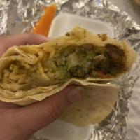 Carne Asada Burrito · Guacamole and Mexican salsa.