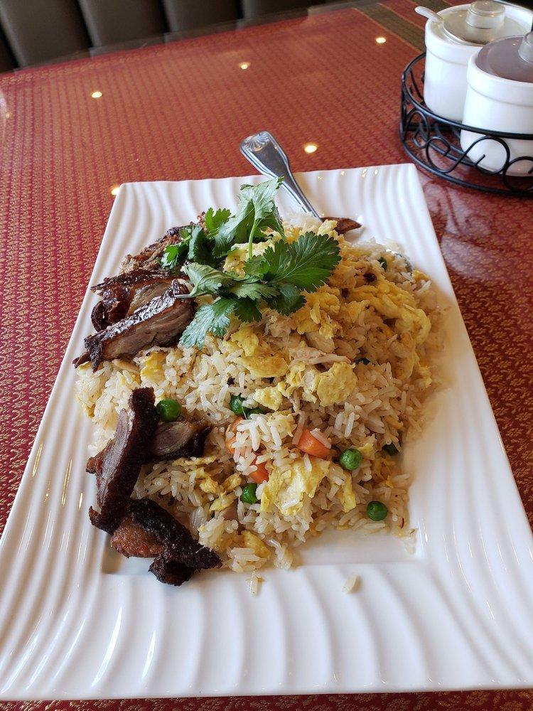 Crab Fried Rice · Fresh Dungeness crab meat is stir-fried with jasmine rice, egg, pea and carrot.