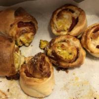 Pepperoni Pinwheels · Our homemade pizza dough stuffed and rolled with pepperoni, banana peppers and mozzarella ch...