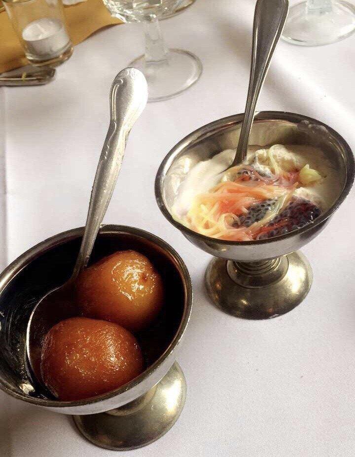 Gulab Jamun · Solidified milk balls, deep-fried, soaked in sugar syrup and served hot.