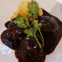 Mole Negro · Traditional thick and rich sauce, made from chocolate, an assortment of dried chilies and nu...