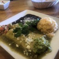 Chicken Enchiladas · 2 enchiladas; Covered with green tomatillo sauce topped with cheese served with rice and bea...